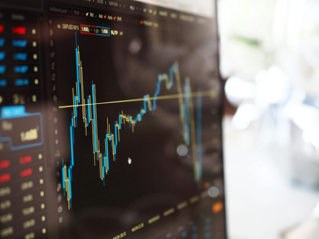 pexels-photo-159888-159888-1 Detailed view of financial trading graphs on a monitor, illustrating stock market trends.